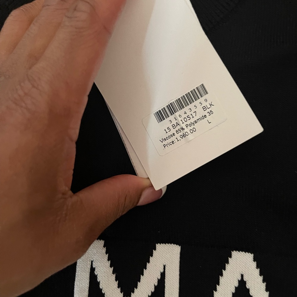 Black Balmain sweater with white writing. Brand new and authentic Great quality